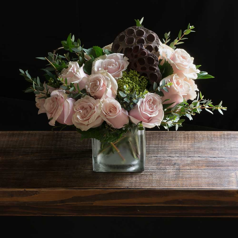 Boutique floral arrangement with all blush, light pink roses.