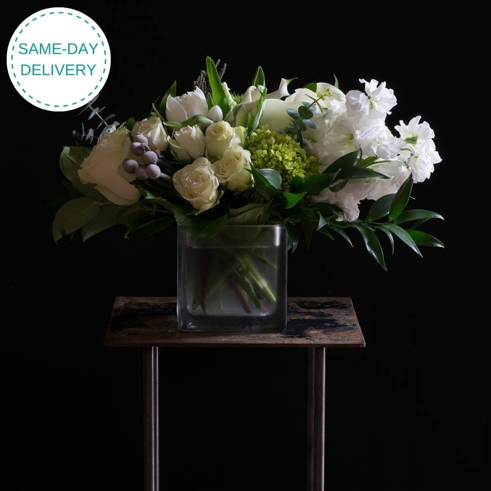 The best unique boutique white flowers arrangement with roses, calla lilies, and tulips