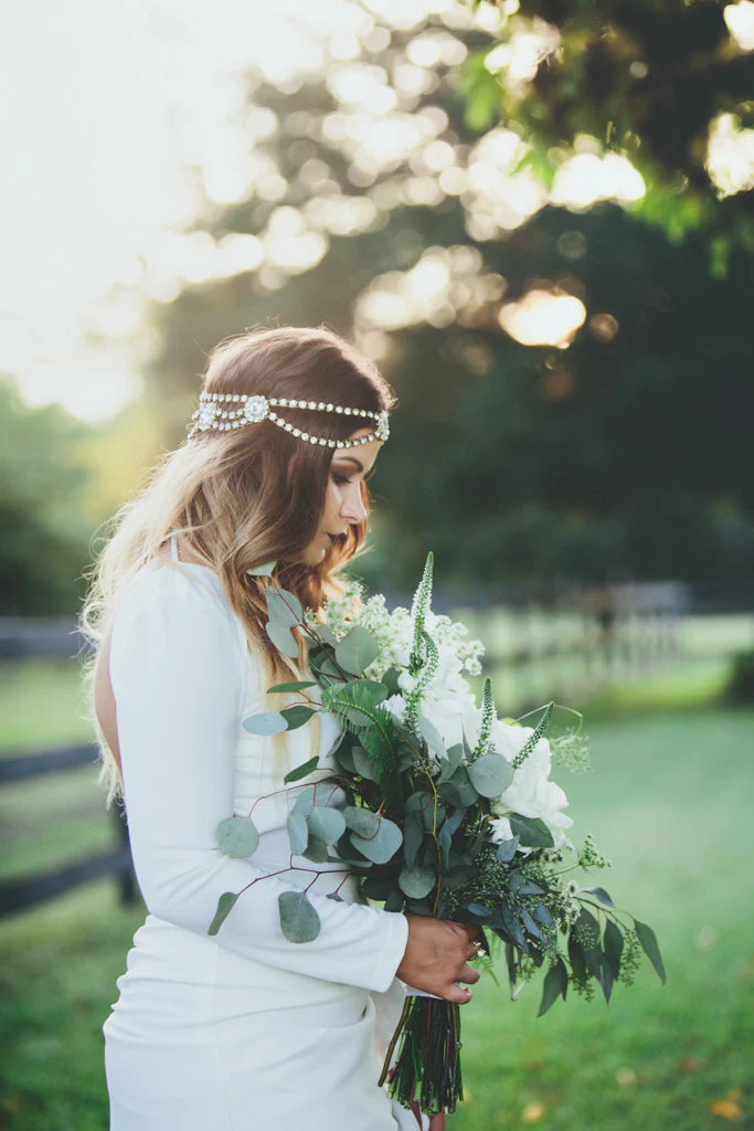 Tara Koenke Photography | Bride with bridal bouquet of white roses, and white flowers