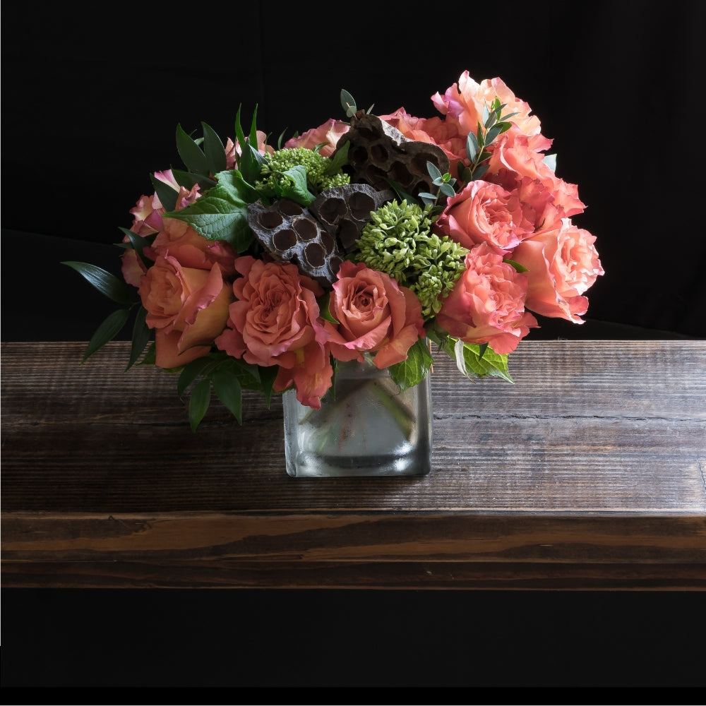Boutique floral arrangement made out of all orange roses.