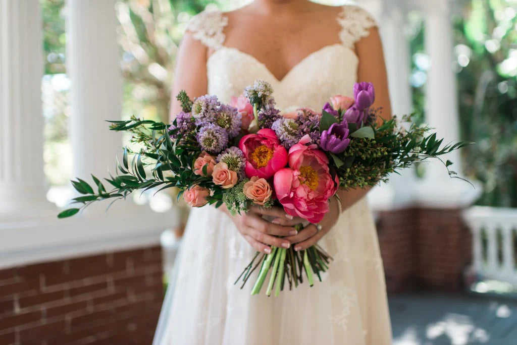 Ashlee Nicole Photography | Gorgeous bridal bouquet with pink peonies, light pink roses, and other colorful flowers