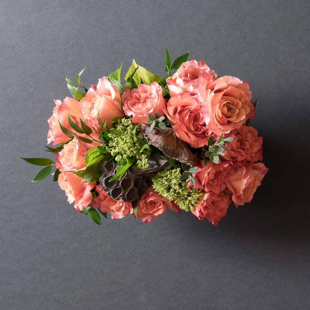 Boutique floral arrangement made out of all orange roses from the top