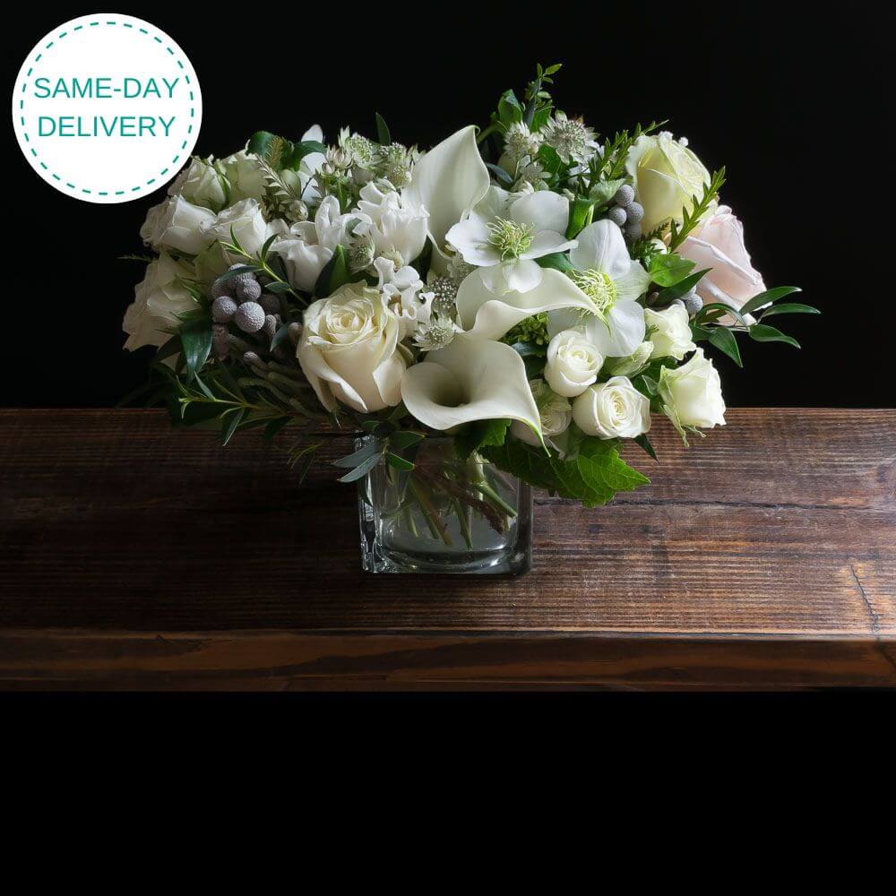 The best unique boutique white flowers arrangement with roses, calla lilies, and tulips