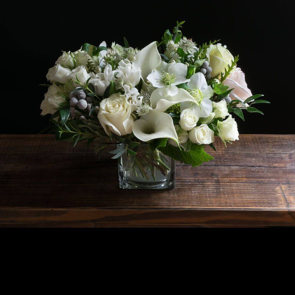 The best unique boutique white flowers arrangement with roses, calla lilies, and tulips