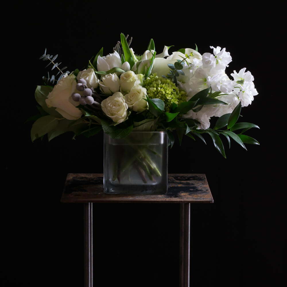 The best unique boutique white flowers arrangement with roses, calla lilies, and tulips