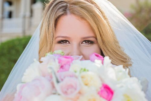 Emma Burdis Photography | Bride holding bridal bouquet with soft pink color and white flowers