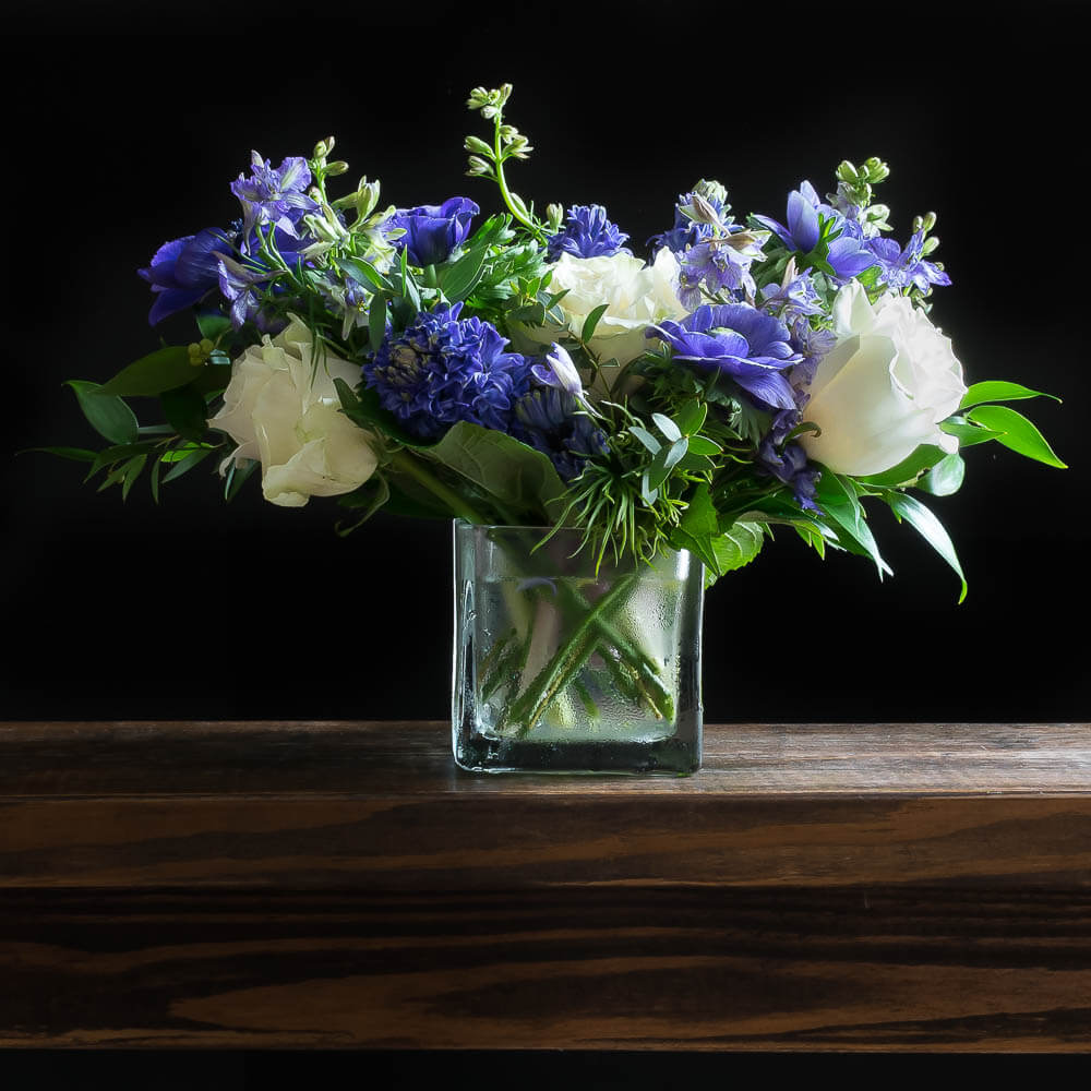 Cool unusual blue, indigo, purple floral arrangement of hydrangeas, blue hyacinths, and blue anemones.