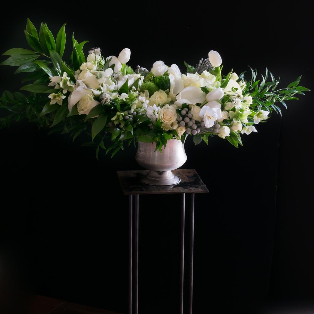 Large luxe boutique white flowers arrangement with white roses, white calla lilies, and white tulips