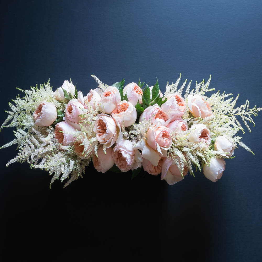 Soft pink, peach boutique floral arrangement