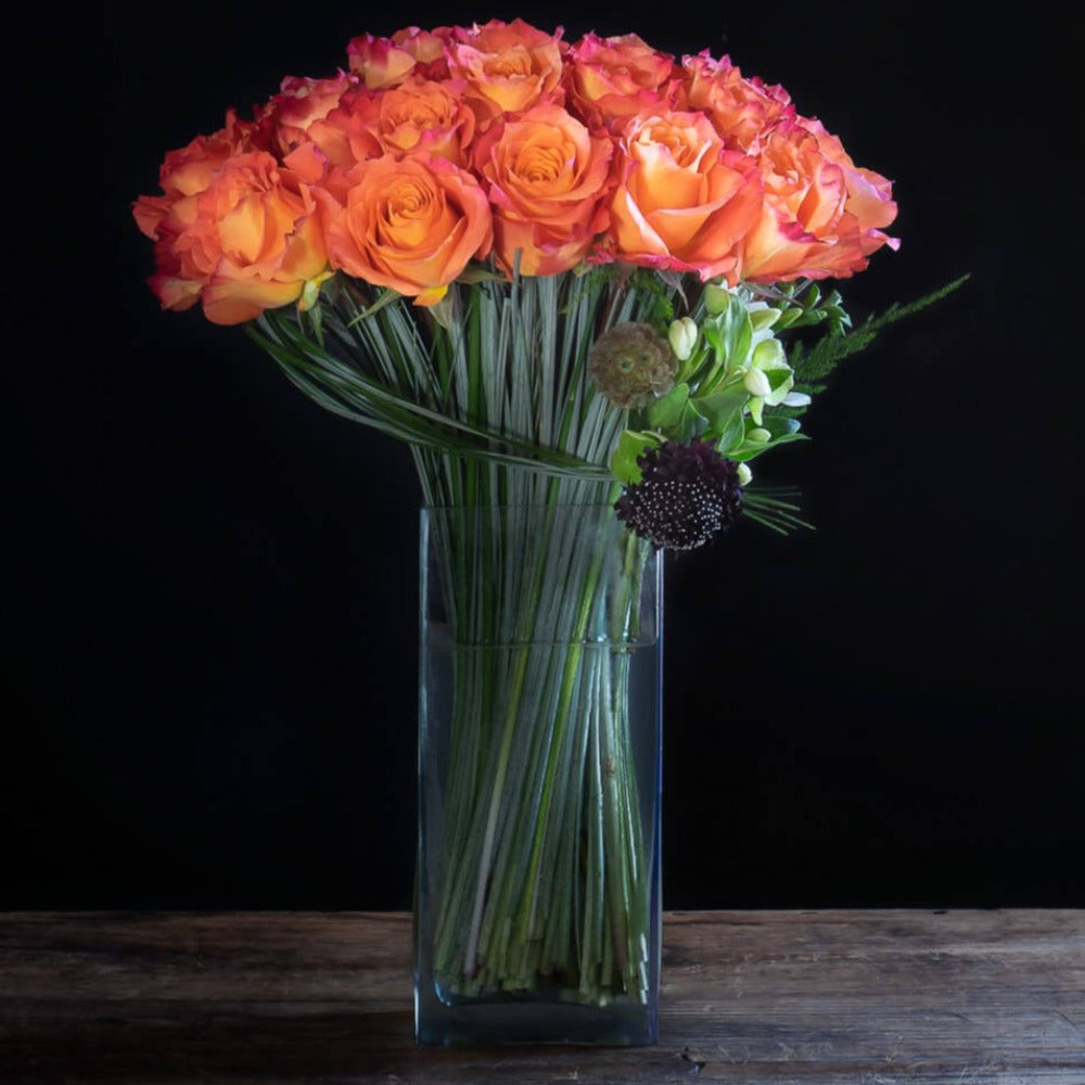Luxury orange roses flower arrangement of 2 dozen long stem roses.