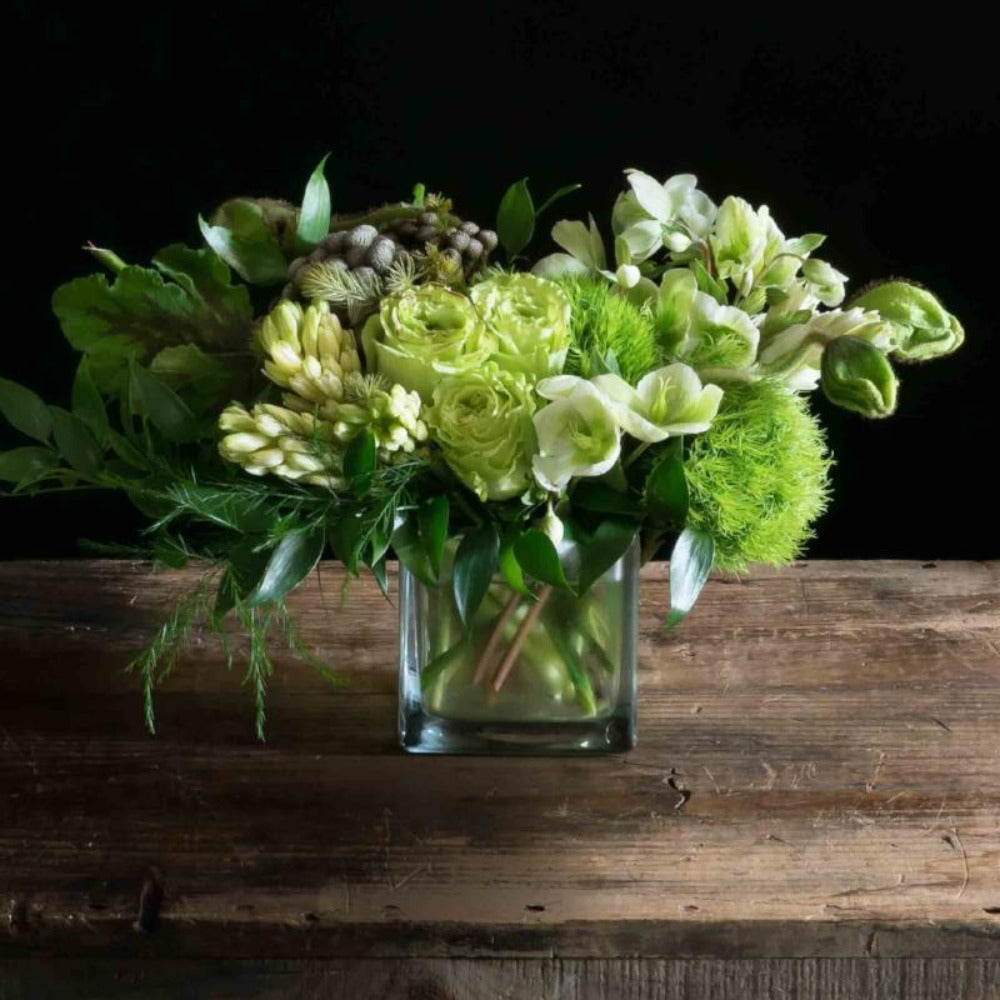 All green flowers boutique floral arrangement with green roses, green hellebores, green mini hydrangeas
