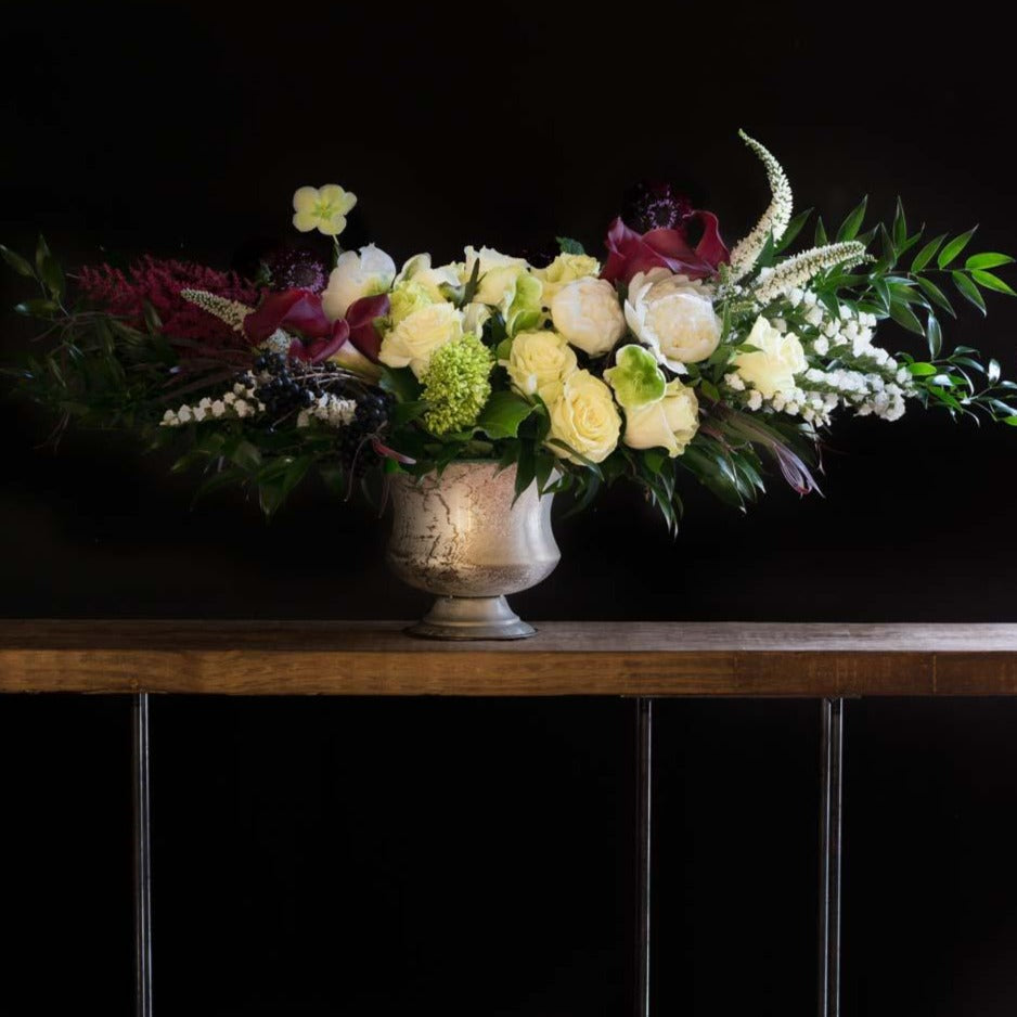 Luxe boutique floral arrangement with white peonies , burgundy callas, white scabiosas