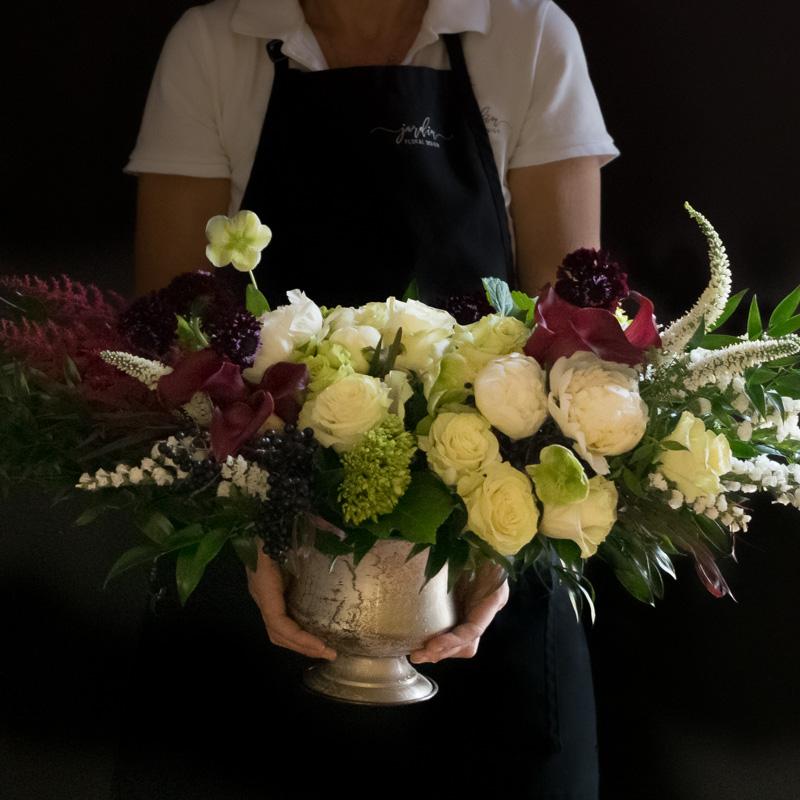 Luxe boutique floral arrangement with white peonies , burgundy callas, white scabiosas