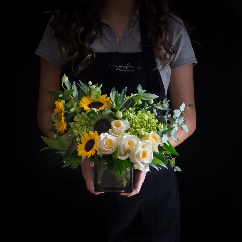Sunflowers, white roses, mini green hydrangeas flower arrangement.